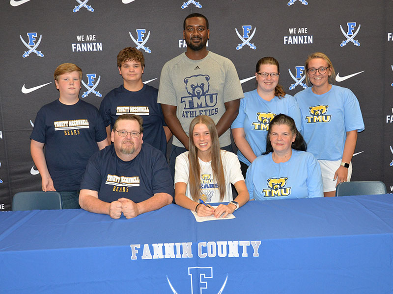 Macy Hawkins was surrounded by her family as signed her Letter of Intent to play basketball for the Truett McConnell University Bears. Witnessing the event were, from left, front, Michael Davis, Hawkins,  and Vera Davis; and, back, Cooper Davis, Levi Davis, Bears Coach Tiek Fields Kayla Shields and Holly King. 